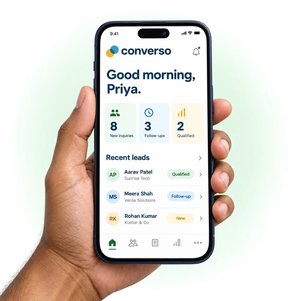 Hand holding a phone with an illustrative Converso app screen